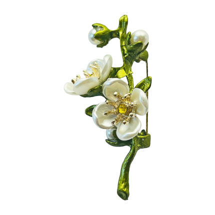 Green jasmine flower branch brooch with white petals, pearl accents, and a yellow crystal center by Divalya.