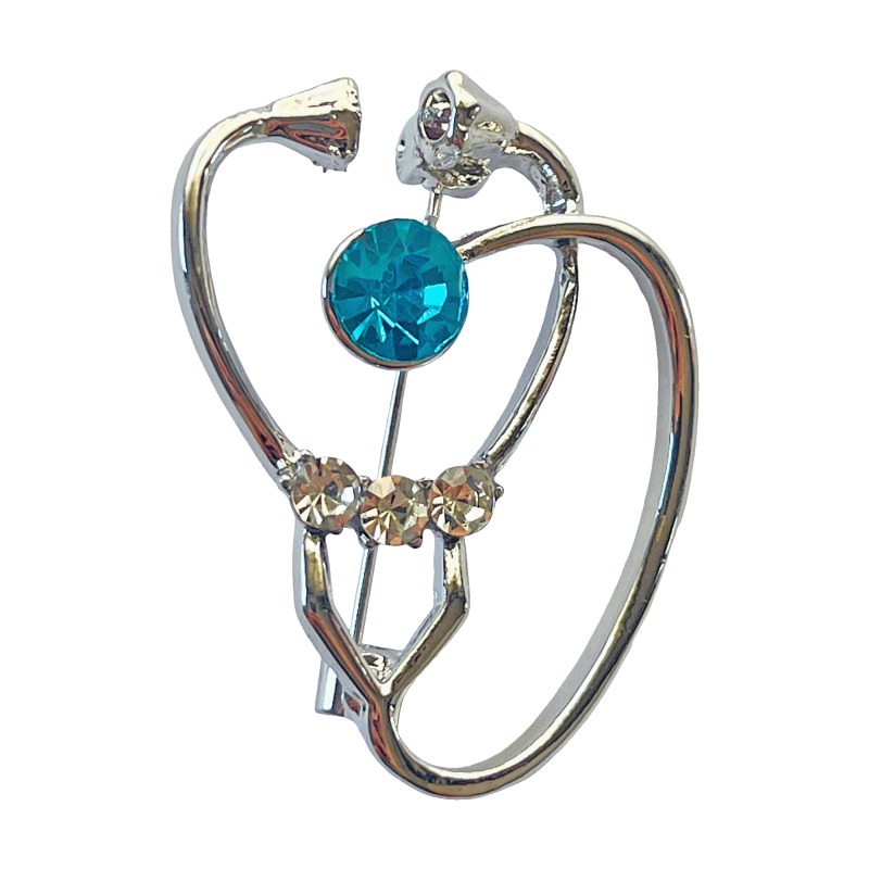 Silver stethoscope brooch with a blue crystal center and clear rhinestone accents by Divalya.
