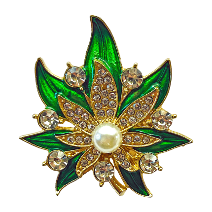 Green enamel starburst flower brooch with pearl center and clear crystal accents by Divalya.