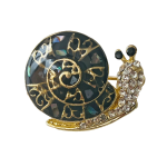 Black snail brooch with gold heart pattern, iridescent shell and clear crystals – Divalya jewelry
