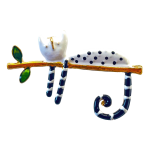 White enamel cat with polka dots sitting on a gold branch brooch – Divalya jewelry